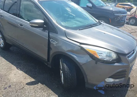 2014 Ford Escape Titanium z USA, uszkodzony, nr VIN 1FMCU0J9XEUC10891